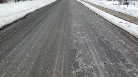 Salt brine sprayed and dried on a road surface for anti-icing before a snow storm