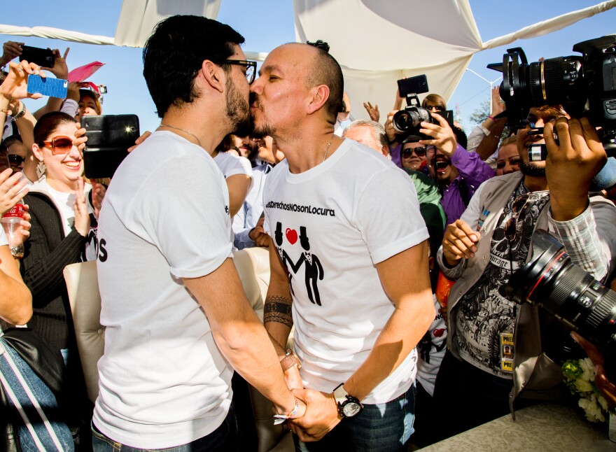 Fernando Urias (left) and Victor Manuel Aguirre kiss after they learned they were allowed to marry, during a protest outside the municipal palace in the northern border city of Mexicali, Mexico, on Jan. 17.