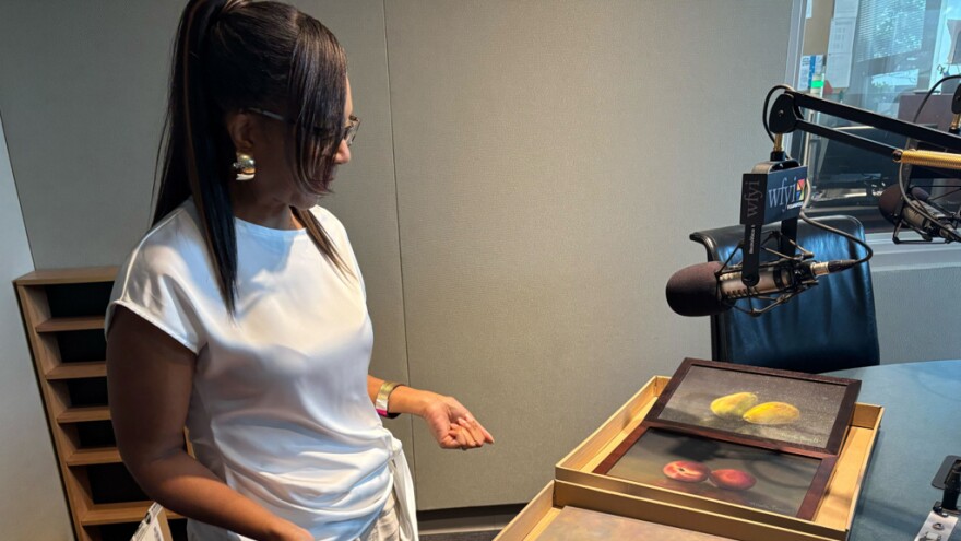 Nicole Powell shows off some of her artwork.