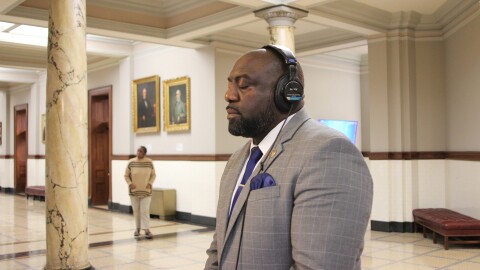 Rep. Jeffrey Hullum III, a Democrat who represents Gulfport and Harrison County, stops at the listening station set up by the Gulf States Newsroom at the Mississippi Capitol in Jackson, Mississippi, on Thursday, March 12, 2026.