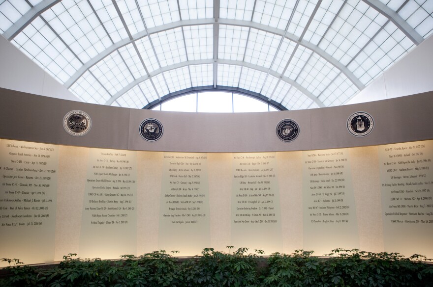 The entryway of the Charles C. Carson Center for Mortuary Affairs. A wall displays the locations, dates, and number of lives lost since the 1960s.