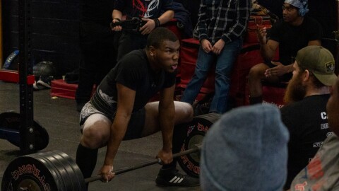 La'Darius James,18, adjusts his grip prior to an exercise set at Lugoff-Elgin High School Feb. 6, 2026.