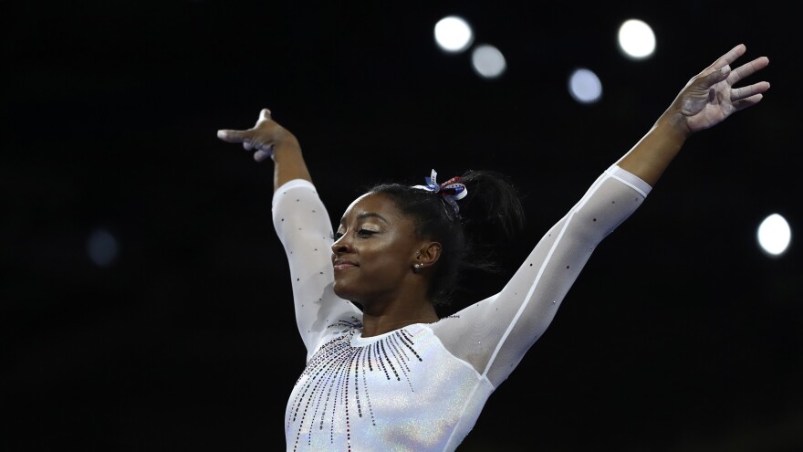 Simone Biles performs on the vault in the women's all-around final at the Gymnastics World Championships in Stuttgart, Germany.