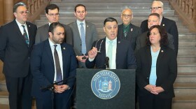 Sen. Anthony Palumbo, center, announces a complaint against Chief Judge Rowan Wilson on March 11, 2026.