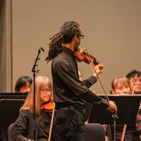 Associate Concertmaster Timothy Jones helps the orchestra tune on Feb. 13.
