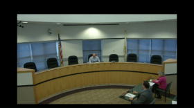 Pekin Mayor Mark Luft sits alone in the council chambers on Mon., March 23, 2020. The other members teleconferenced in to comply with mandates limiting the number of people in one room.