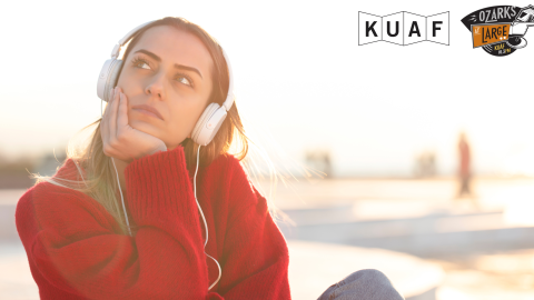 A woman with headphones on