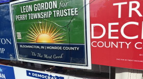 broken glass in front of campaign posters 
