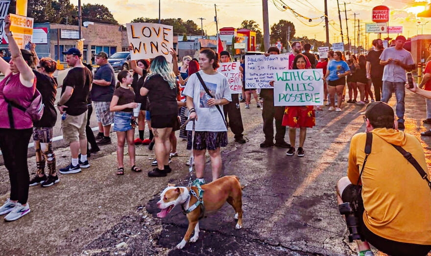 Demonstrators line Summer Avenue on Sunday to protest the El Corralon raid.