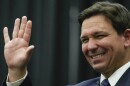 Gov. Ron DeSantis waves during a press conference Sept. 22, 2022, in Miami. 