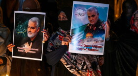Shiite Muslims hold pictures of slain top Iranian general Qasem Soleimani to pay him tribute during a candle light vigil in Islamabad January 8, 2020. (Aamir Qureshi/AFP via Getty Images)