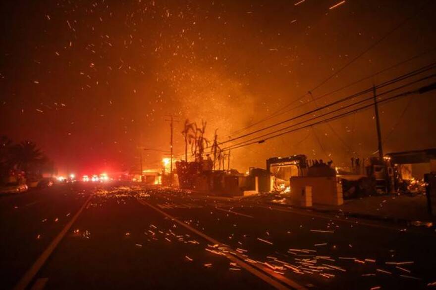 Strong winds blow embers as the Palisades Fire burns homes on the Pacific Coast Highway amid a powerful windstorm in Los Angeles, California. Hundreds of American Red Cross workers are helping residents fleeing from the massive and fast-moving wildfires that have destroyed homes of all kinds and sizes.