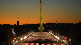 A field of flags is spread across the National Mall, with the Washington Monument in the background ahead of the 59th Presidential Inauguration in Washington. (AP Photo/Susan Walsh)