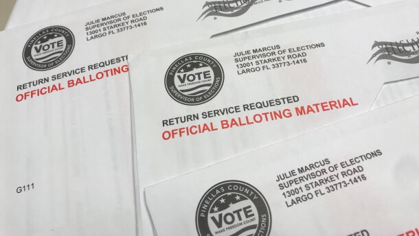 stack of mail-in ballots  
