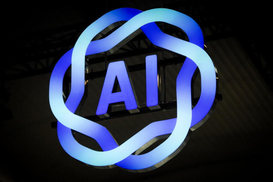 Signage of AI is displayed during the MWC (Mobile World Congress), the world's biggest mobile fair, in Barcelona on March 3, 2025. (Manaure Quintero/AFP via Getty Images)