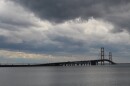 The Mackinac Bridge on a stormy day, with dark rain clouds overhead