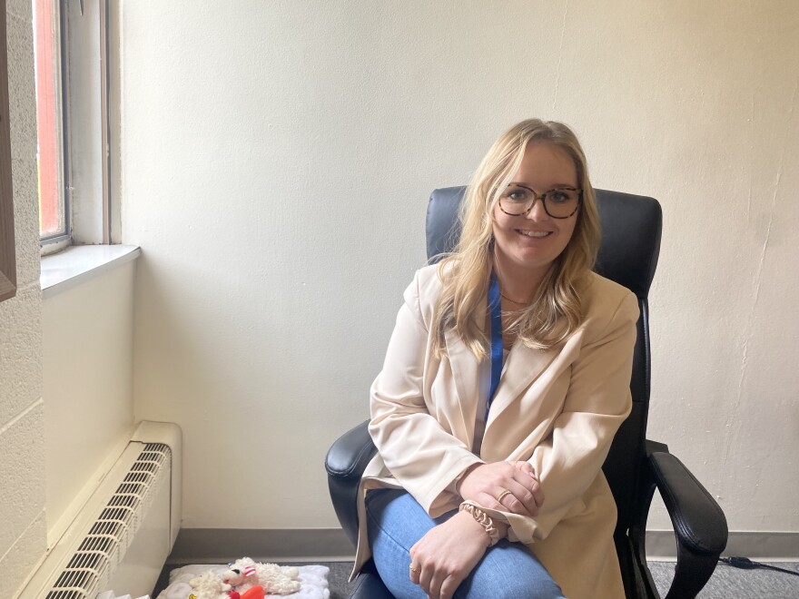 LSI refugee resettlement coordinator Katie Hagen sits in her office.