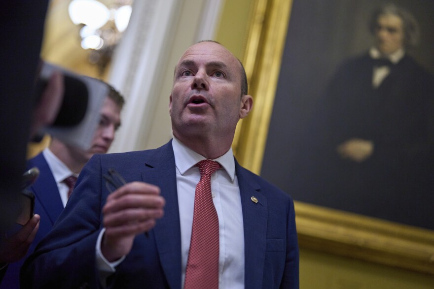 Sen. Mike Lee, R-Utah, speaks to a reporter as senators arrive for votes and policy meetings, at the Capitol in Washington, Tuesday, June 17, 2025. (AP Photo/J. Scott Applewhite)