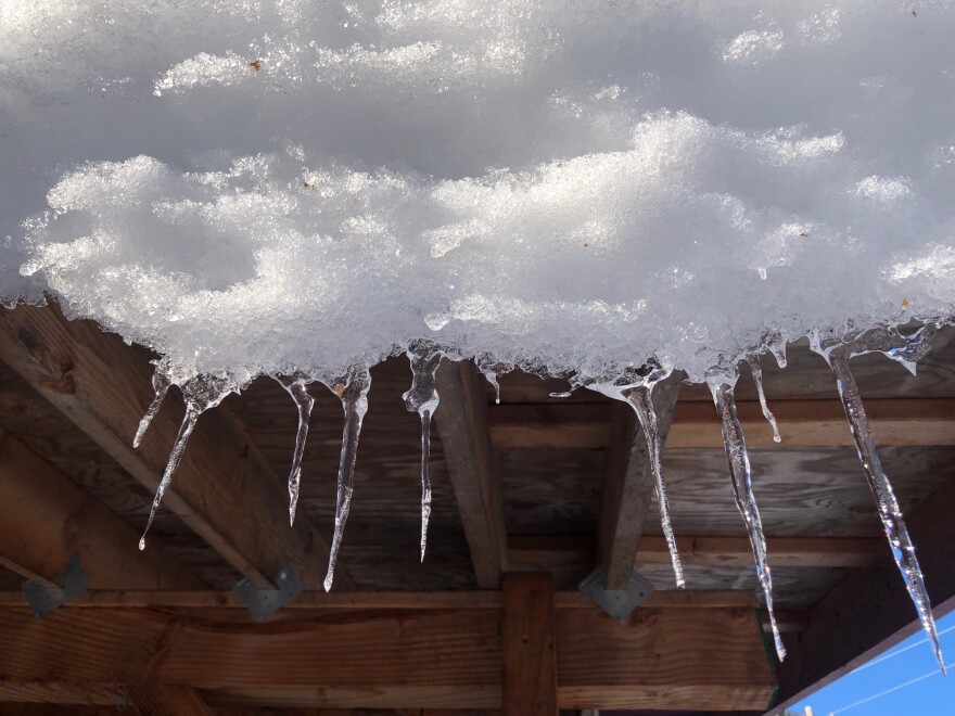 Icicles drip from a roof in Fairbanks on March 29, 2024.