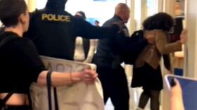 Screen grab of the incident, captured on video obtained by Connecticut Public shows people being detained on campus by New Haven police.