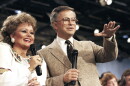FILE -FILE - Jim And Tammy Faye Bakker talk to their television audience, Aug. 20, 1986 at their PTL Ministry in Fort Mill, S.C. (AP Photo/Lou Krasky, File)
