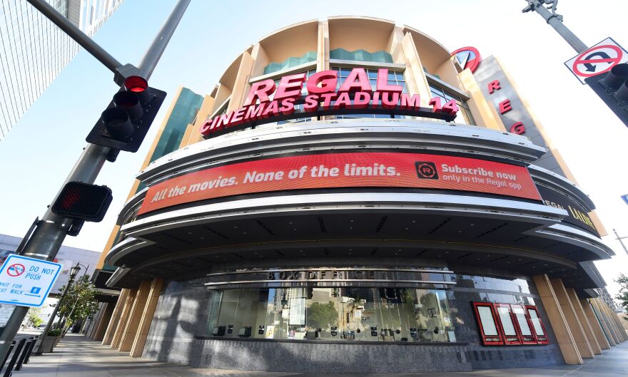 Regal Cinemas says it will reopen its U.S. theaters next month. A closed box office is seen here in Los Angeles in June after theaters were closed due to the pandemic.