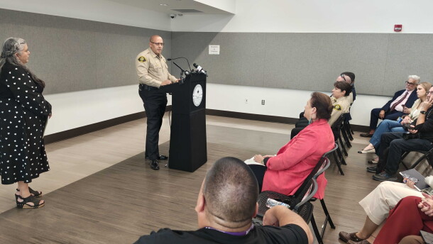 Bernalillo County Commission Chair Adriann Barboa, left, looks on as Bernalillo County Sheriff John Allen addresses those who attended a press conference on Wednesday announcing the proposed declaration, which will be aimed at expanding revocery services and treatment options.