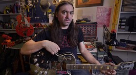 High Voltage Music co-owner Chris Lomba in his backyard shop in north Seattle.