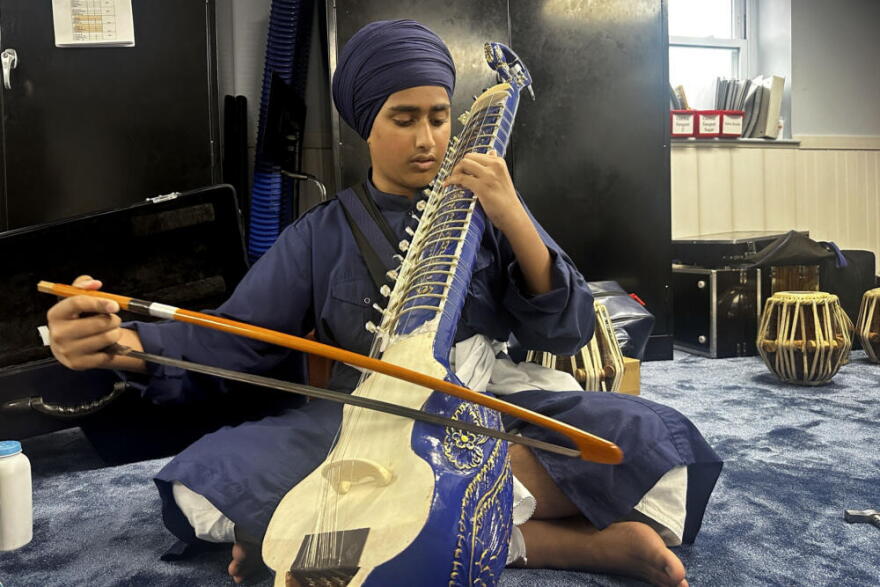 Damanjot Singh, 13, plays a taur at the Sikh gurdwara in Medford. (Simón Rios/WBUR)