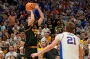 Iowa forward Alvaro Folgueiras (7) makes a game winning 3-point shot over Florida forward Alex Condon (21), Sunday, March 22, 2026, in Tampa.