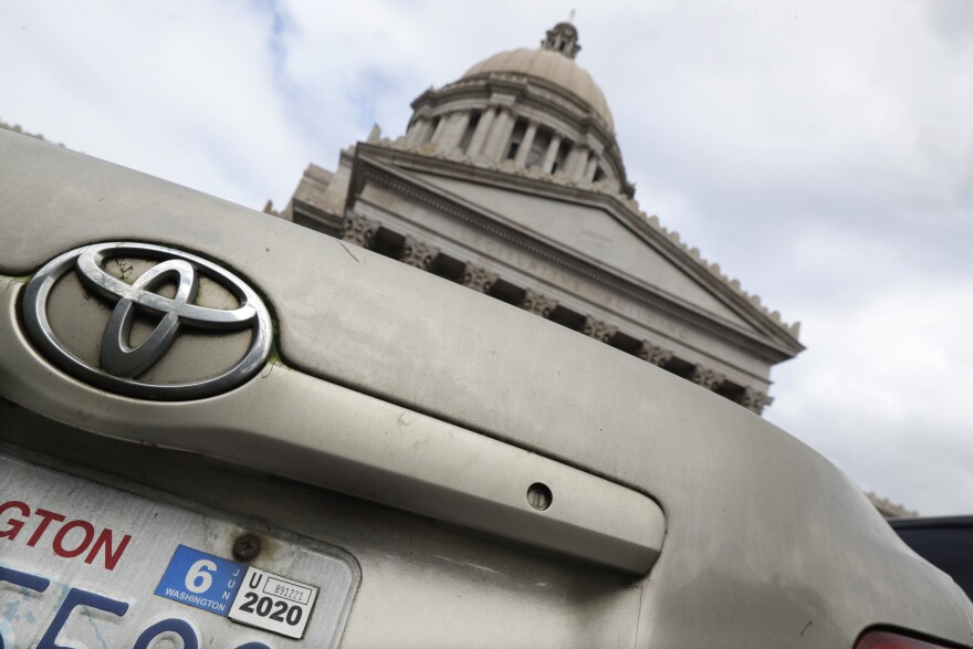 A car registration tab is shown on a vehicle parked at the Capitol, Wednesday, Feb. 12, 2020, in Olympia, Wash. The Washington Supreme Court unanimously struck down Tim Eyman's Initiative 976 in a ruling issued Thursday. 