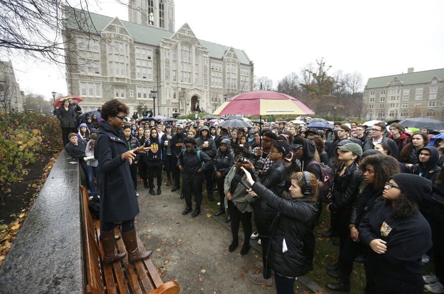 Students at Boston College listen to a speaker as they gather during a solidarity demonstration on the school's campus, Thursday, Nov. 12, 2015, in Newton, Mass. Student organizers from the college released a toolkit for protesters at other campuses — part of a growing trend towards nationwide coordination of protests.