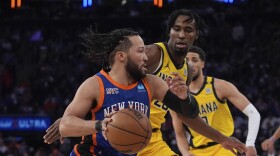 New York Knicks' Jalen Brunson, left, drives past Indiana Pacers' Aaron Nesmith during the second half of Game 5 in an NBA basketball second-round playoff series, Tuesday, May 14, 2024, in New York. The Knicks won 121-91. (AP Photo/Frank Franklin II)