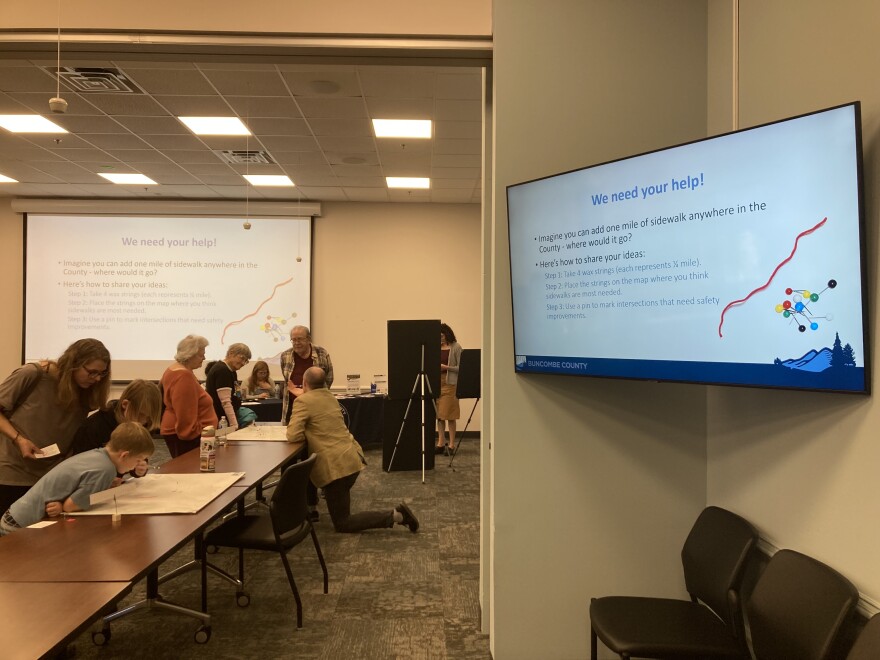 County staff speak with residents during a community meeting about the Pedestrian Plan Monday, March 9, 2026.