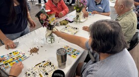 Seniors play loteria with youth from San Luis High School.