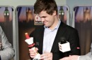 Magnus Carlsen with the London Chess Classic trophy after he won.