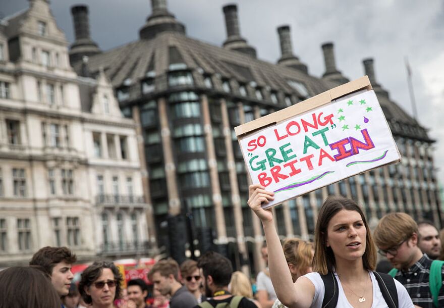 A group of people gather to protest on Parliament Square the day after the majority of the British public voted to leave the European Union on in London.
