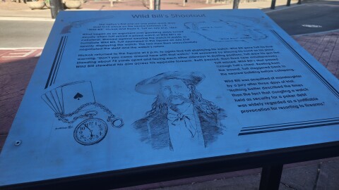 Sign on the southwest corner of the square that tells about the shootout between Wild Bill Hickok and Davis Tutt (photo taken on February 20, 2026).