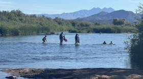 Volunteers remove trash from the Salt River on National Public Lands Day