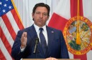 Gov. Ron DeSantis speaks from a podium 