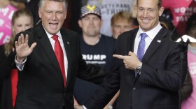 Rep. Ted Budd, R-NC, right, points to Republican congressional candidate Mark Harris, left, during a campaign rally in Charlotte, N.C., Friday, Oct. 26, 2018. 
