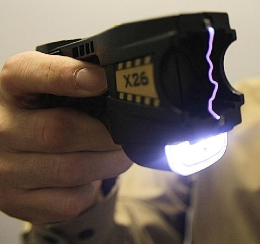 Former Brattleboro Police Chief John Martin is seen demonstrating a Taser in this 2007 file photo.