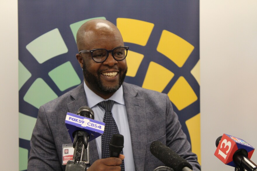 Shadreck Kamwendo, director of the Mosaic Center, speaks at the ribbon cutting for the center.