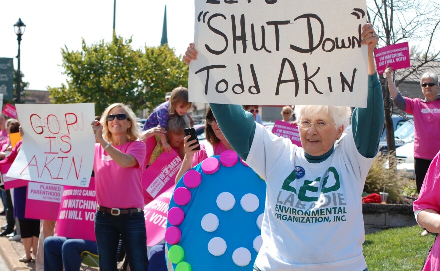 Planned Parenthood organized a protest outside a fundraiser for Todd Akin on Monday.