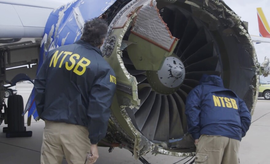 The Southwest Airlines jet blew the engine at 32,000 feet and got hit by shrapnel that smashed a window, setting off a desperate scramble by passengers to save a woman from getting sucked out. She later died. / Tuesday, April 17, 2018, frame from video.