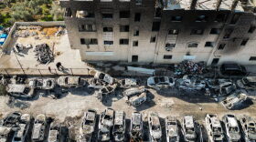 An aerial view of a scrapyard where cars were torched overnight, in the Palestinian town of Huwara near Nablus in the occupied West Bank.