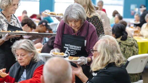 Volunteers serve Thanksgiving meals at Waterfront Rescue Mission. 