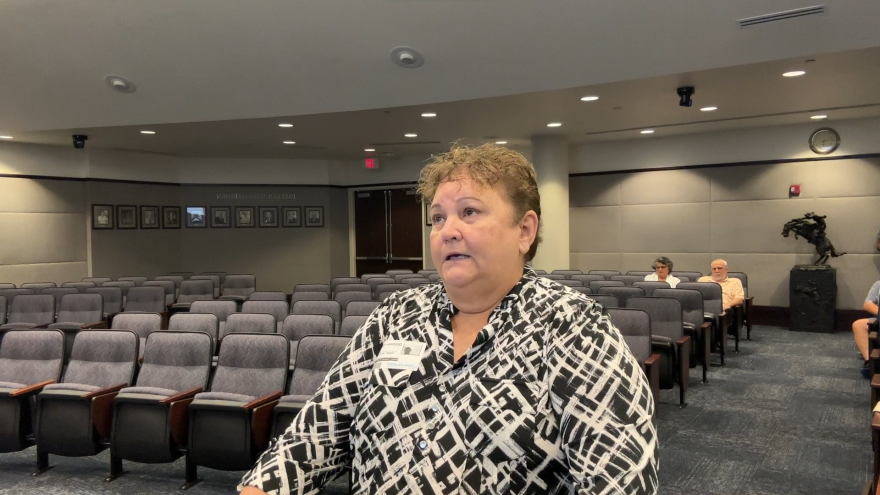 Image of a woman speaking during the public comment period of a recent Osceola County meeting.