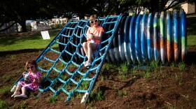 Olivia and Sophie Niedert, left to right, were with their families during the June 24 opening of the "Territories," an outdoor public art installation on the Ann and Roy Butler Hike and Bike Trail at Lakeshore Park. 