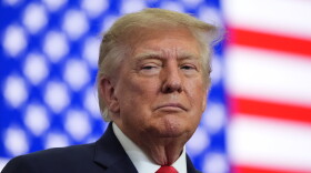 President Donald Trump listens at a campaign rally at the Curtis D. Menard Memorial Sports Center, Tuesday, Oct. 13, 2026, in Wasilla, Alaska. (AP Photo/Alex Brandon)